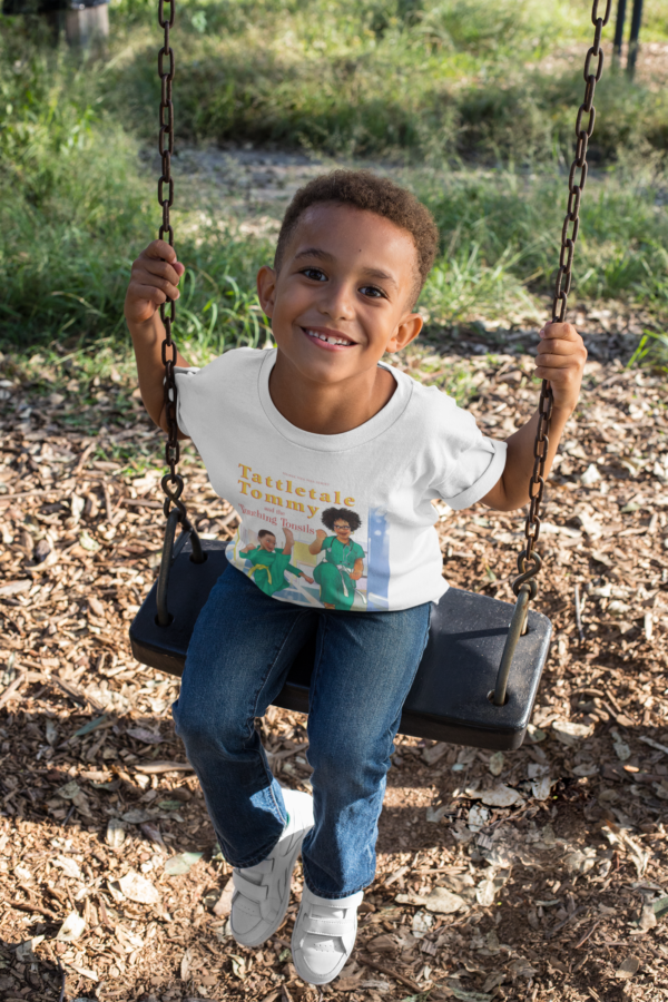 A young boy is sitting on a swing.