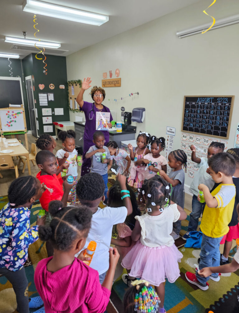 A woman giving a class to young and adorable toddlers